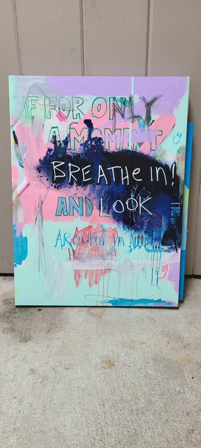 Turquoise and pink painting with Breathe In text